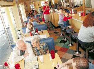 TP 134246 - - DELIVER TO: city times - - 1/20/2002 - - South Tampa - - CAPTION INFO: PHOTO 1: Guy Gillen (cq/bottom left) and Pat McGreevy (cq) give their lunch orders to waiter Thomas DeGroat (cq/bottom right) at the Old Meeting House on S. Howard Ave. Sunday. The restaurant, a South Tampa landmark since 1947, is adding a sidewalk cafe to increase visibility and accommodate larger crowds. - - Times Photo by: Stefanie Boyar - - Story By: Susan Thurston - - SCANNED BY: - - RUN DATE: 1/25/2002